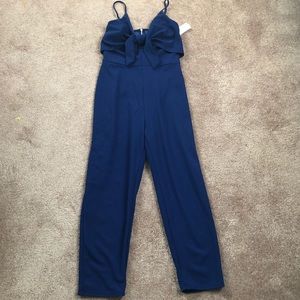 Blue jumpsuit with tags brand new, zip in the back